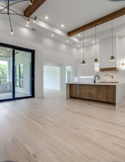 Spacious modern kitchen with large sliding glass doors leading to an outdoor area.